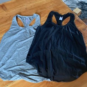 Four Athletics racer back workout tanks. Size large (8)